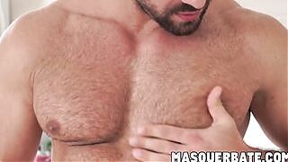 Muscular gay hunk playing with his big curved cock