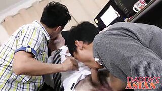 Daddy sucking and fucking two Asian twinks in the office